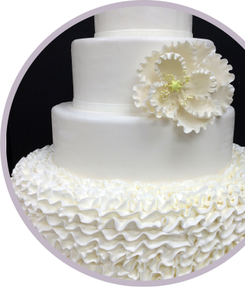 Photo: white wedding cale with fondant decoration and flower
